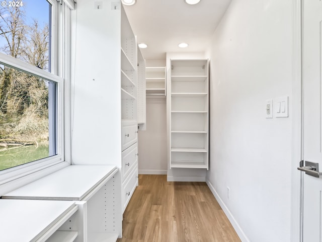 walk in closet featuring light hardwood / wood-style floors