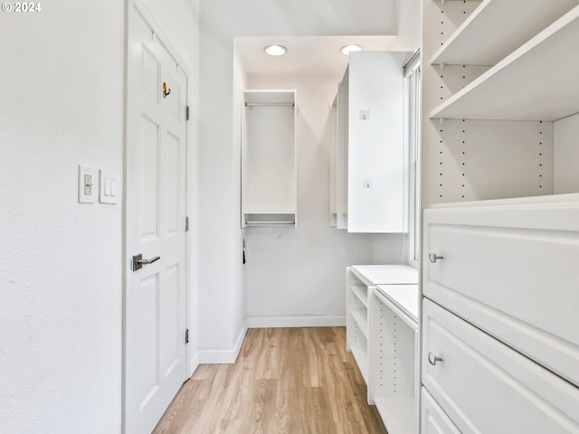 spacious closet with light wood-type flooring