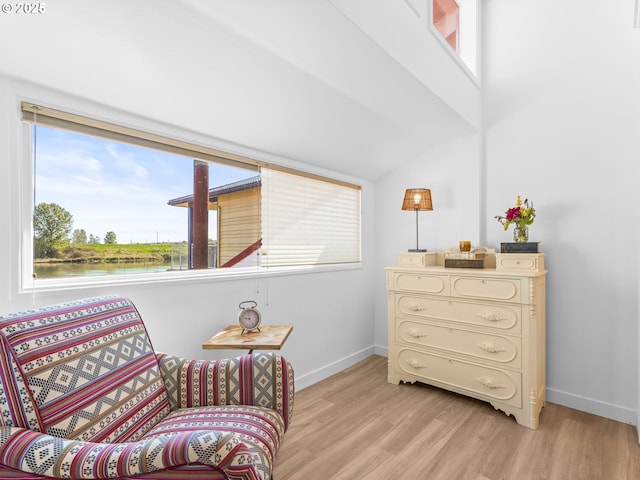 14581 NW Larson Rd Unit 7, Portland, OR 97231 - living area featuring light wood-type flooring, a healthy amount of sunlight, and baseboards