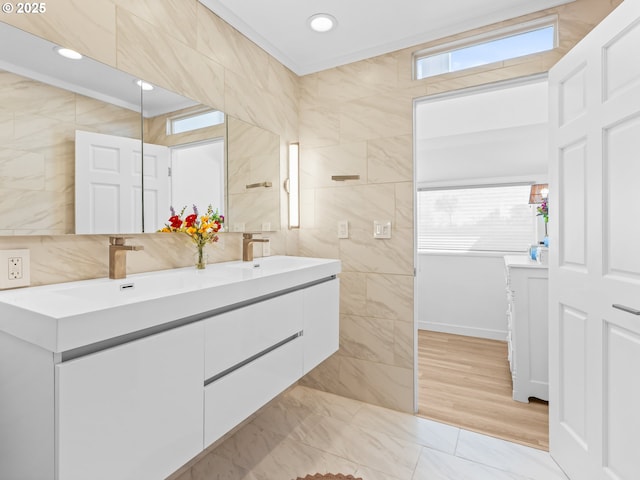 14581 NW Larson Rd Unit 7, Portland, OR 97231 - bathroom with crown molding, a sink, double vanity, and tile walls