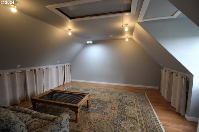 bonus room featuring light hardwood / wood-style floors and vaulted ceiling