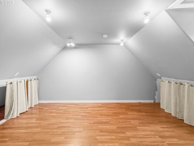 14581 NW Larson Rd Unit 7, Portland, OR 97231 - additional living space with vaulted ceiling, light wood-style floors, and baseboards