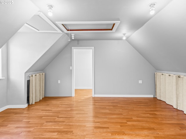 14581 NW Larson Rd Unit 7, Portland, OR 97231 - bonus room with attic access, vaulted ceiling, and light wood-style flooring