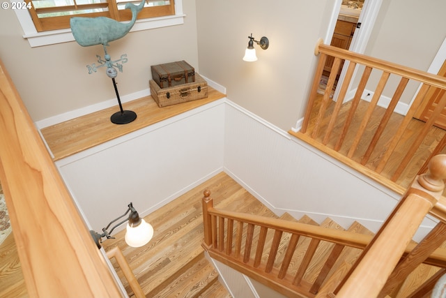 stairway featuring hardwood / wood-style flooring