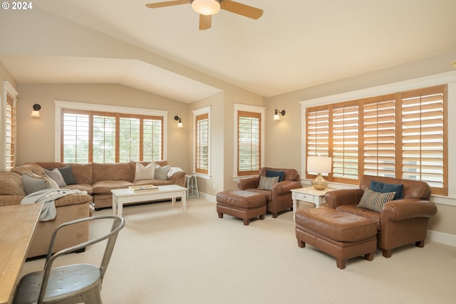 living room with carpet, vaulted ceiling, and ceiling fan