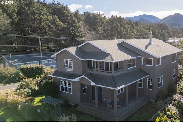 back of property with a mountain view