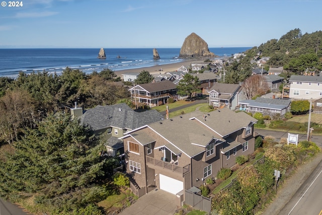 aerial view with a water view and a view of the beach