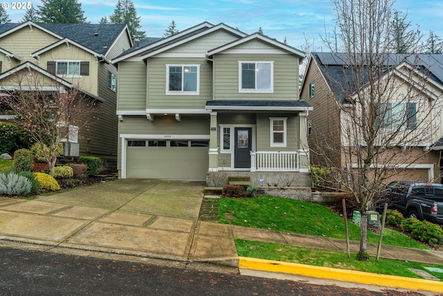 craftsman-style house with covered porch and a garage