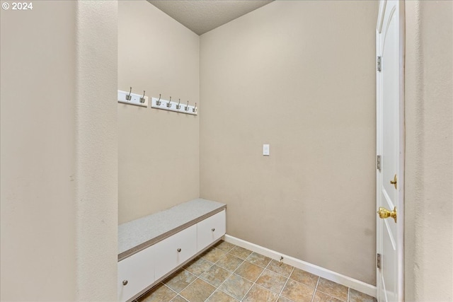 laundry area featuring light tile patterned floors