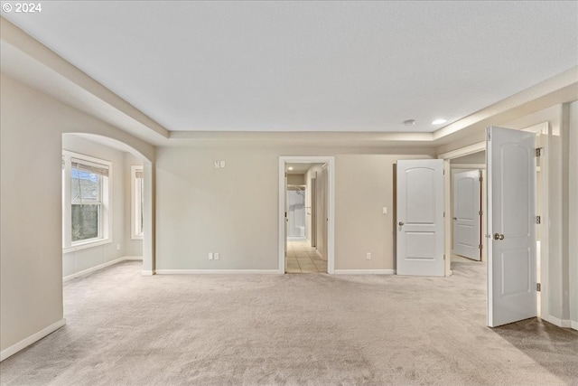 empty room featuring light colored carpet