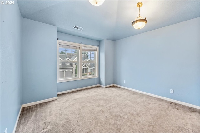 unfurnished room featuring carpet flooring