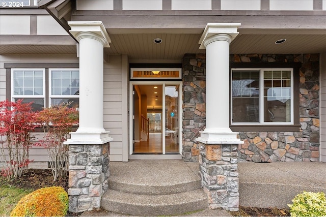 view of exterior entry featuring a porch