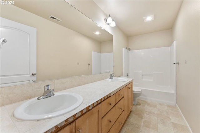 full bathroom featuring tile patterned floors, vanity, toilet, and shower / bathtub combination