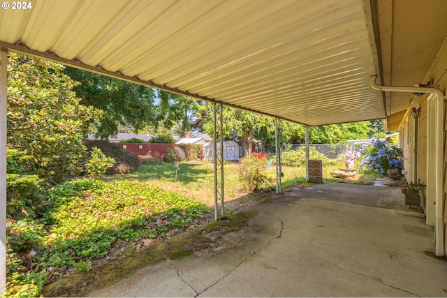 view of patio with a storage shed