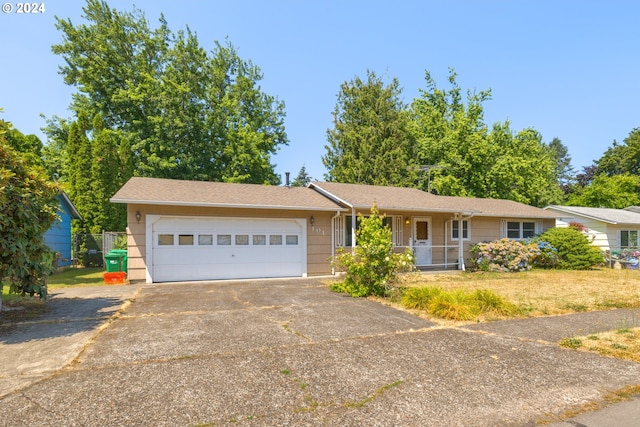 single story home with a front yard and a garage