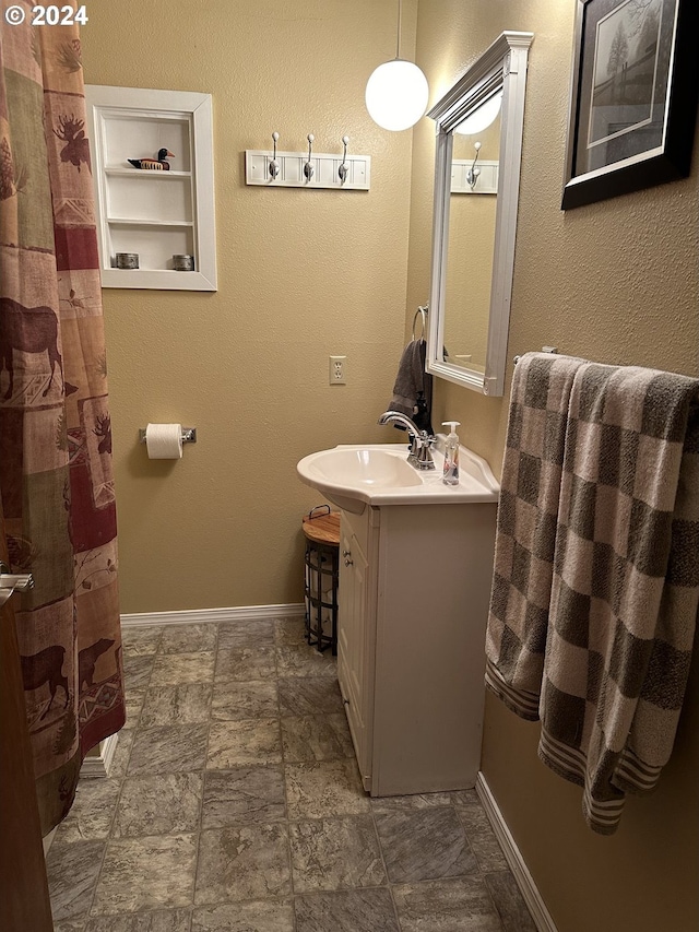 bathroom featuring tile patterned floors and vanity