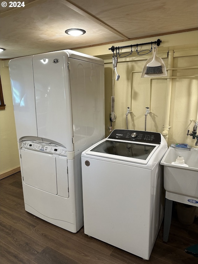 washroom featuring independent washer and dryer and wood-type flooring