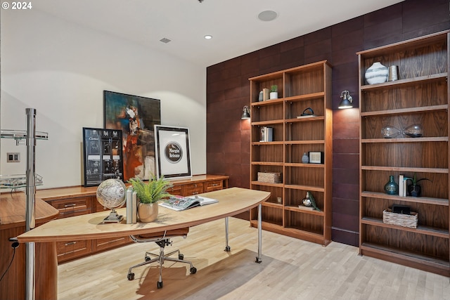 office with light hardwood / wood-style flooring