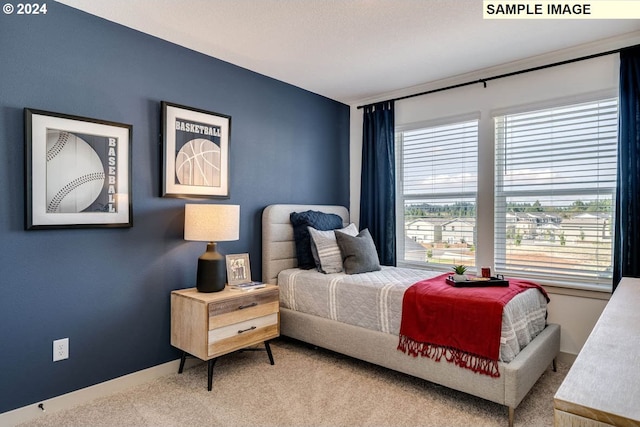 bedroom featuring carpet flooring and baseboards