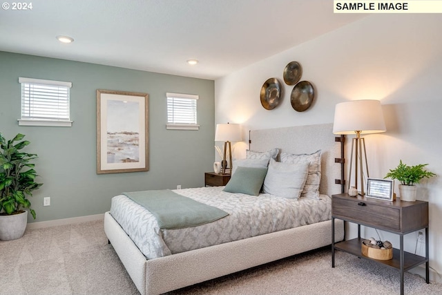 carpeted bedroom featuring multiple windows, recessed lighting, and baseboards