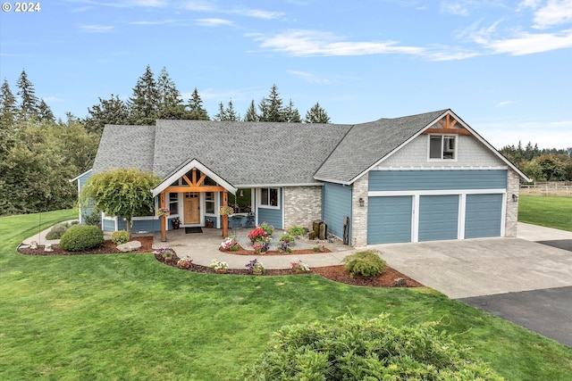 craftsman-style home featuring a garage and a front lawn