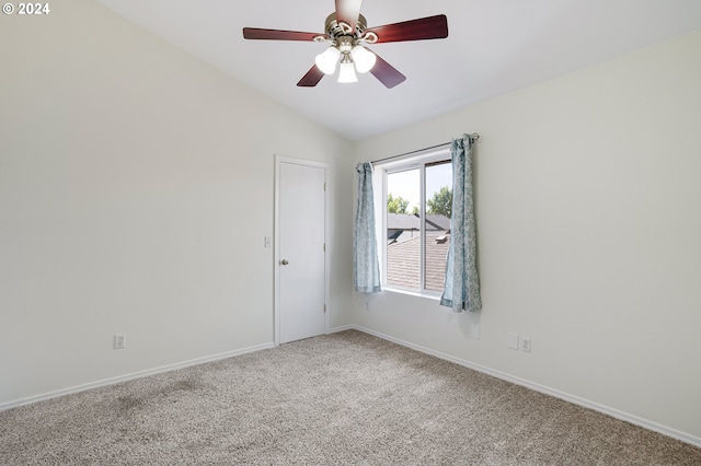 carpeted spare room with lofted ceiling and ceiling fan