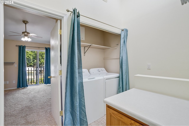 laundry room with independent washer and dryer, light colored carpet, and ceiling fan