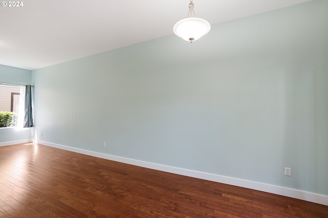 empty room featuring wood-type flooring