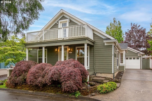 view of front of house featuring a garage and a balcony