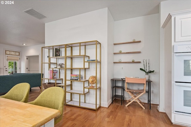 office area with light wood-type flooring