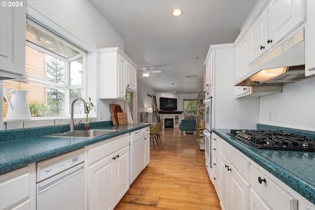 kitchen featuring ceiling fan, sink, black gas cooktop, white cabinets, and light hardwood / wood-style floors