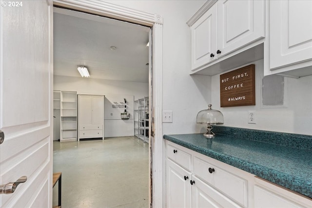 kitchen featuring white cabinetry