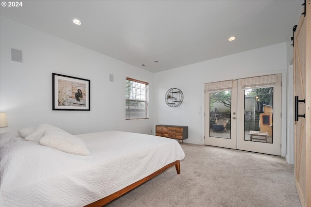 bedroom with light colored carpet, access to outside, and french doors