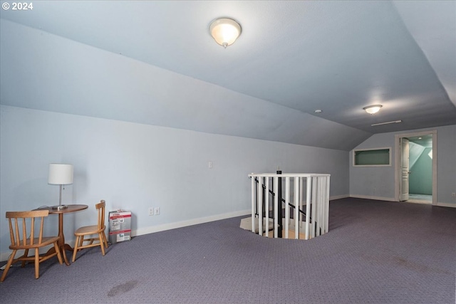 bonus room featuring carpet flooring and vaulted ceiling