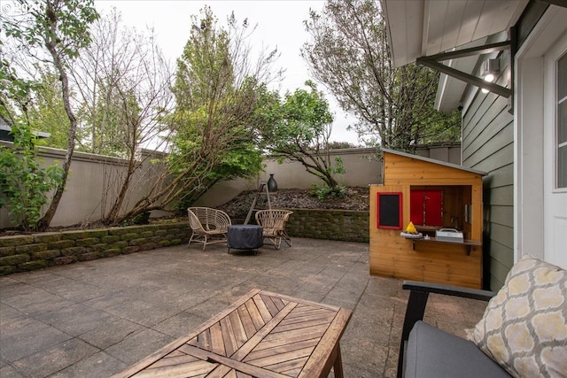 view of patio with an outdoor structure