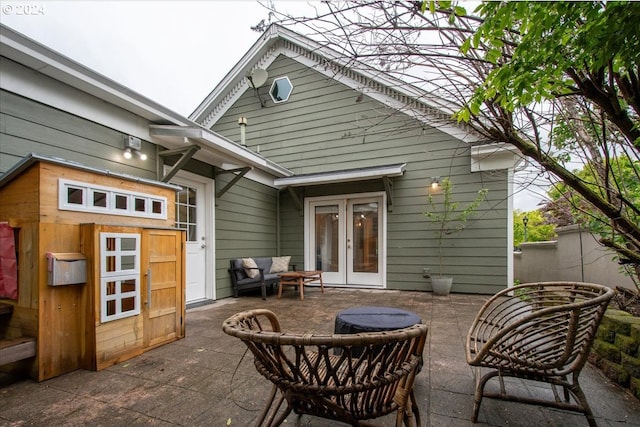 back of house with french doors and a patio