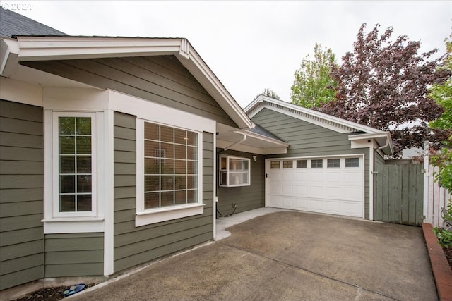 view of side of property featuring a garage