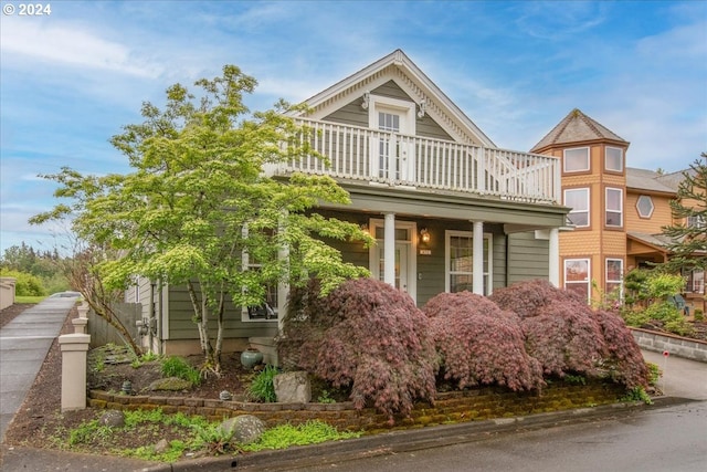 view of front of house with a balcony