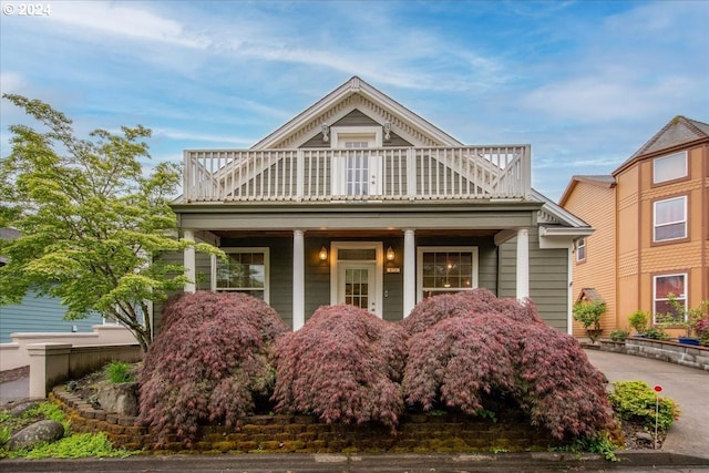 view of front of property with a balcony