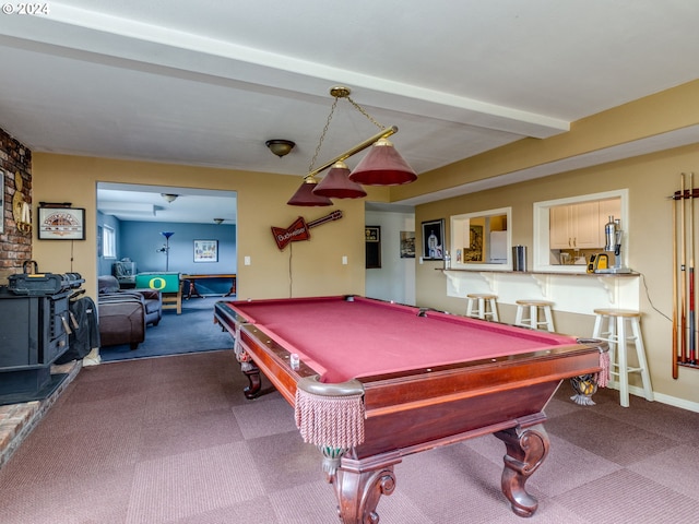 rec room with carpet, a wood stove, beamed ceiling, and billiards