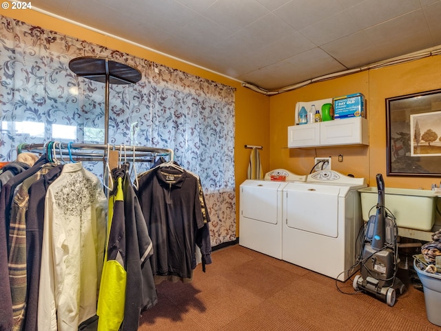 laundry room with cabinets, carpet floors, and separate washer and dryer