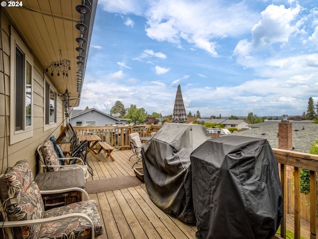 wooden terrace featuring grilling area