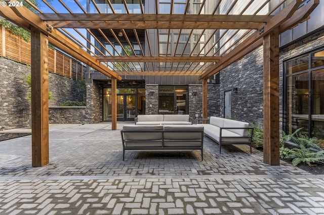 view of patio featuring a pergola and an outdoor living space