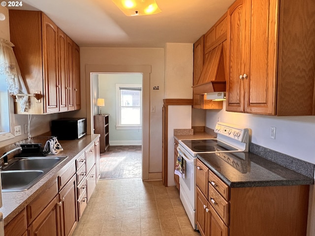 kitchen with custom exhaust hood, white electric range, and sink