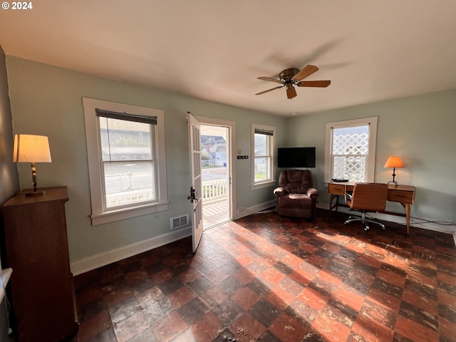 sitting room featuring ceiling fan