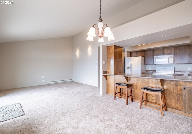 kitchen with a breakfast bar area, an inviting chandelier, light colored carpet, and white appliances