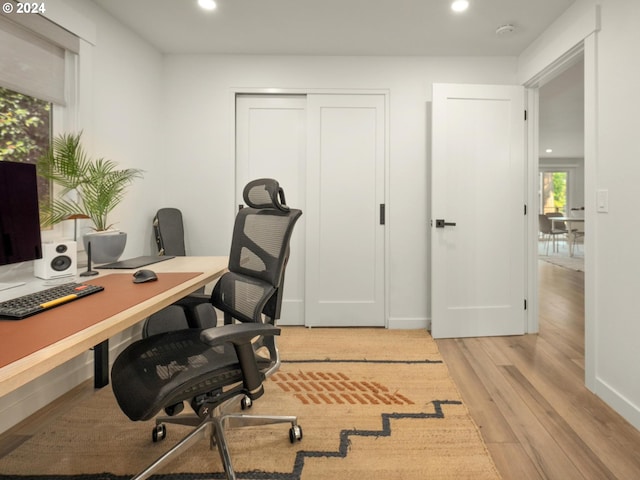 office space with light hardwood / wood-style floors