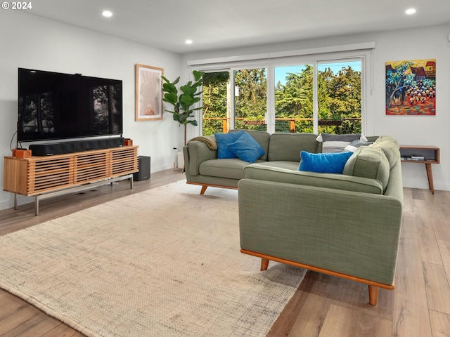 818 Ash St, Lake Oswego, OR 97034 - living area with healthy amount of natural light, recessed lighting, wood finished floors, and baseboards