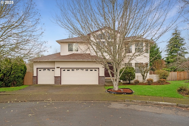 view of front of home with a garage and a front yard