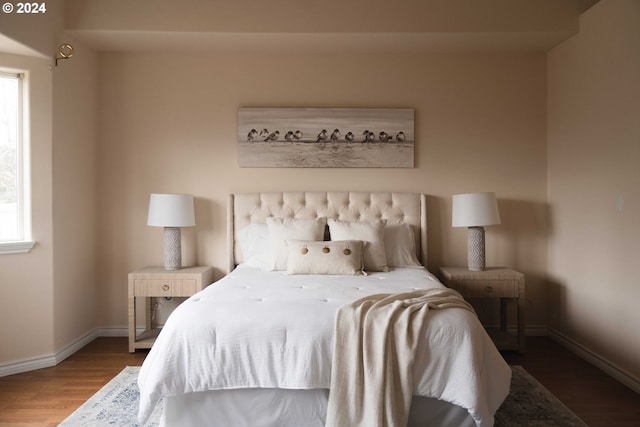 bedroom featuring dark hardwood / wood-style flooring